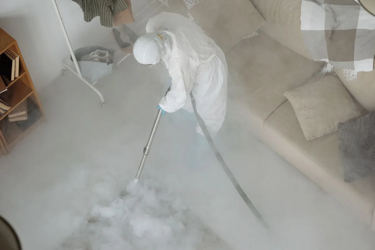 Biohazard cleanup technician in protective equipment, Passaic, NJ